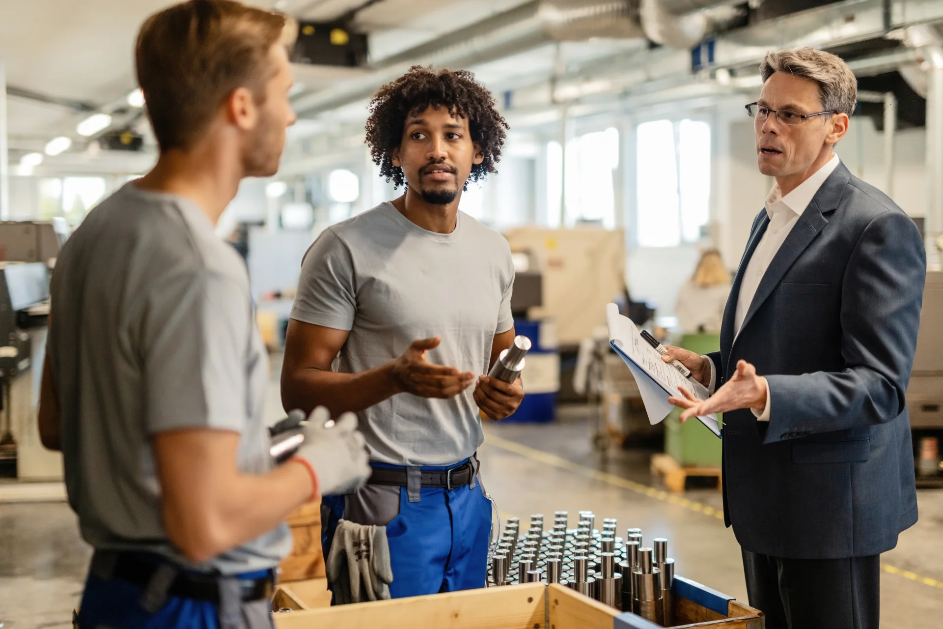 workers-while-performing-quality-control-check-manufactured-rod-cylinders-factory workers-while-performing-quality-control-check-manufactured-rod-cylinders-factory