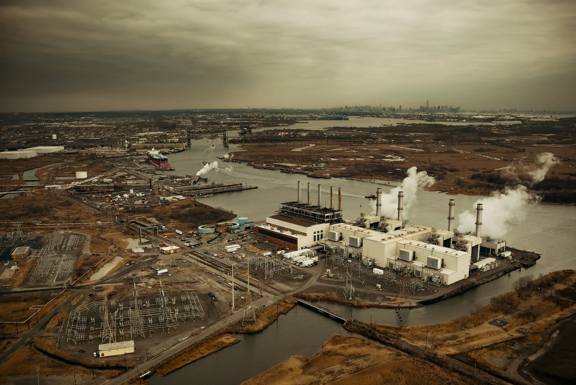 new-jersey-oil-industry-with-new-york-city-skyline-from-afar-aerial-view new-jersey-oil-industry-with-new-york-city-skyline-from-afar-aerial-view