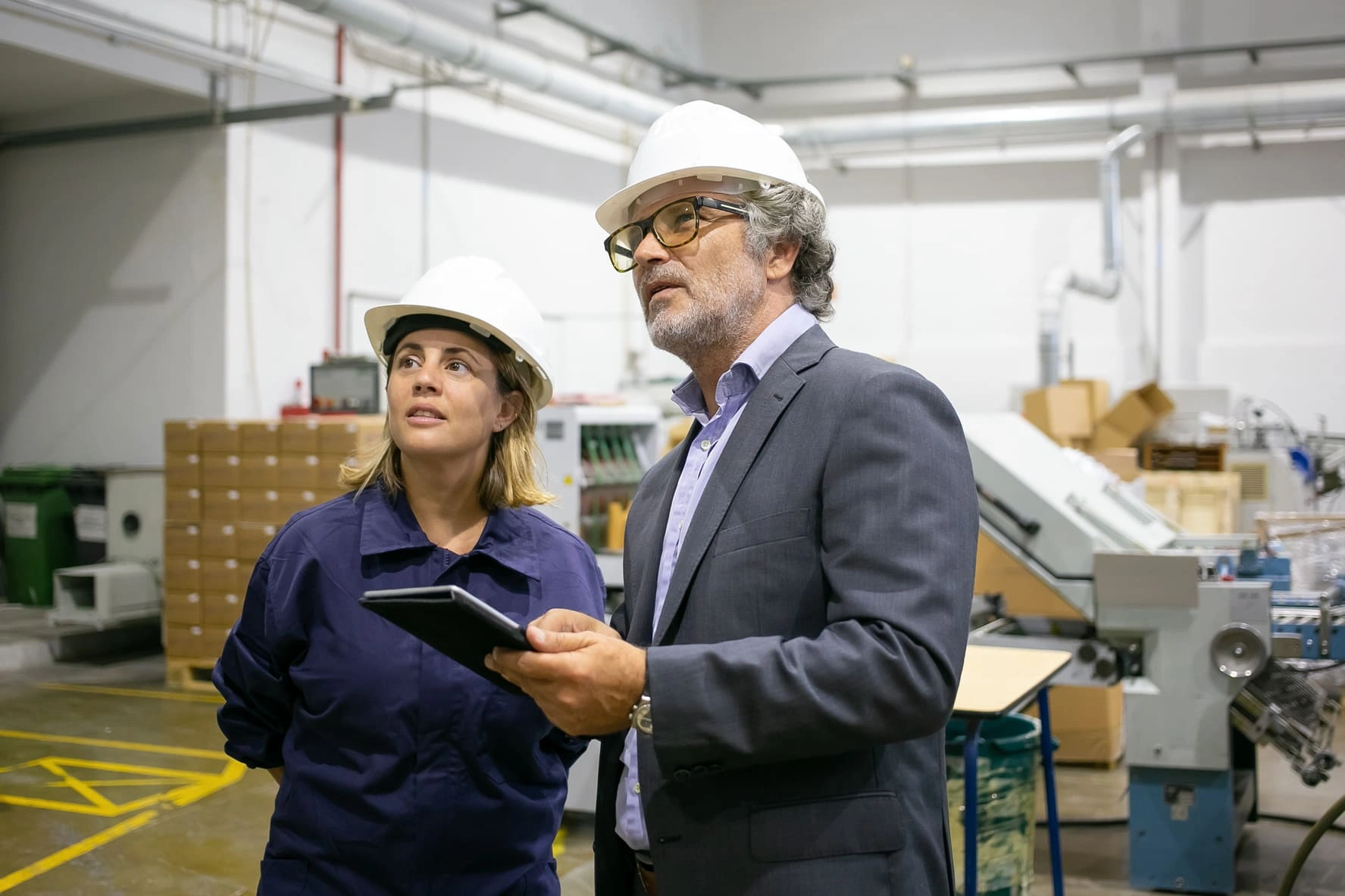 confident-bearded-supervisor-talking-with-female confident-bearded-supervisor-talking-with-female