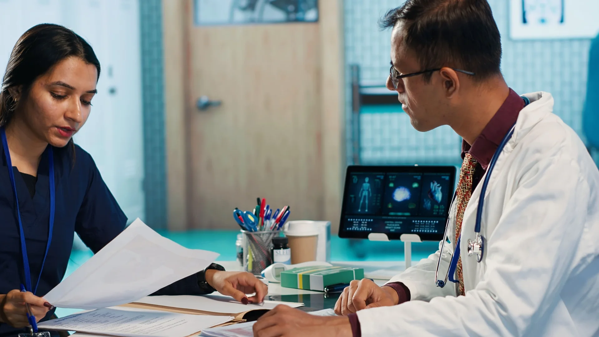 general-practitioner-consulting-patient-reviewing-x-ray-test-results general-practitioner-consulting-patient-reviewing-x-ray-test-results