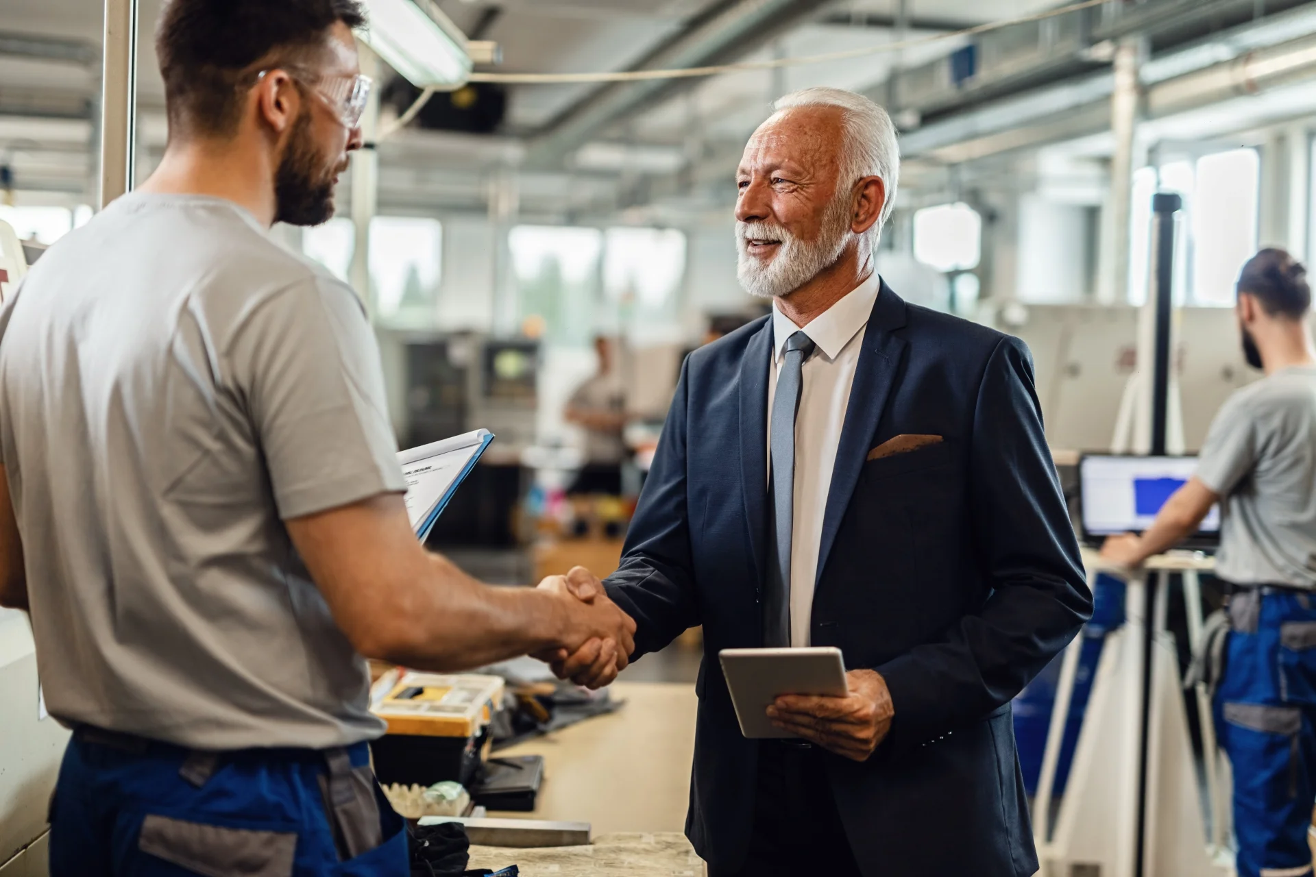 happy-mature-company-manager-handshaking-with-worker happy-mature-company-manager-handshaking-with-worker