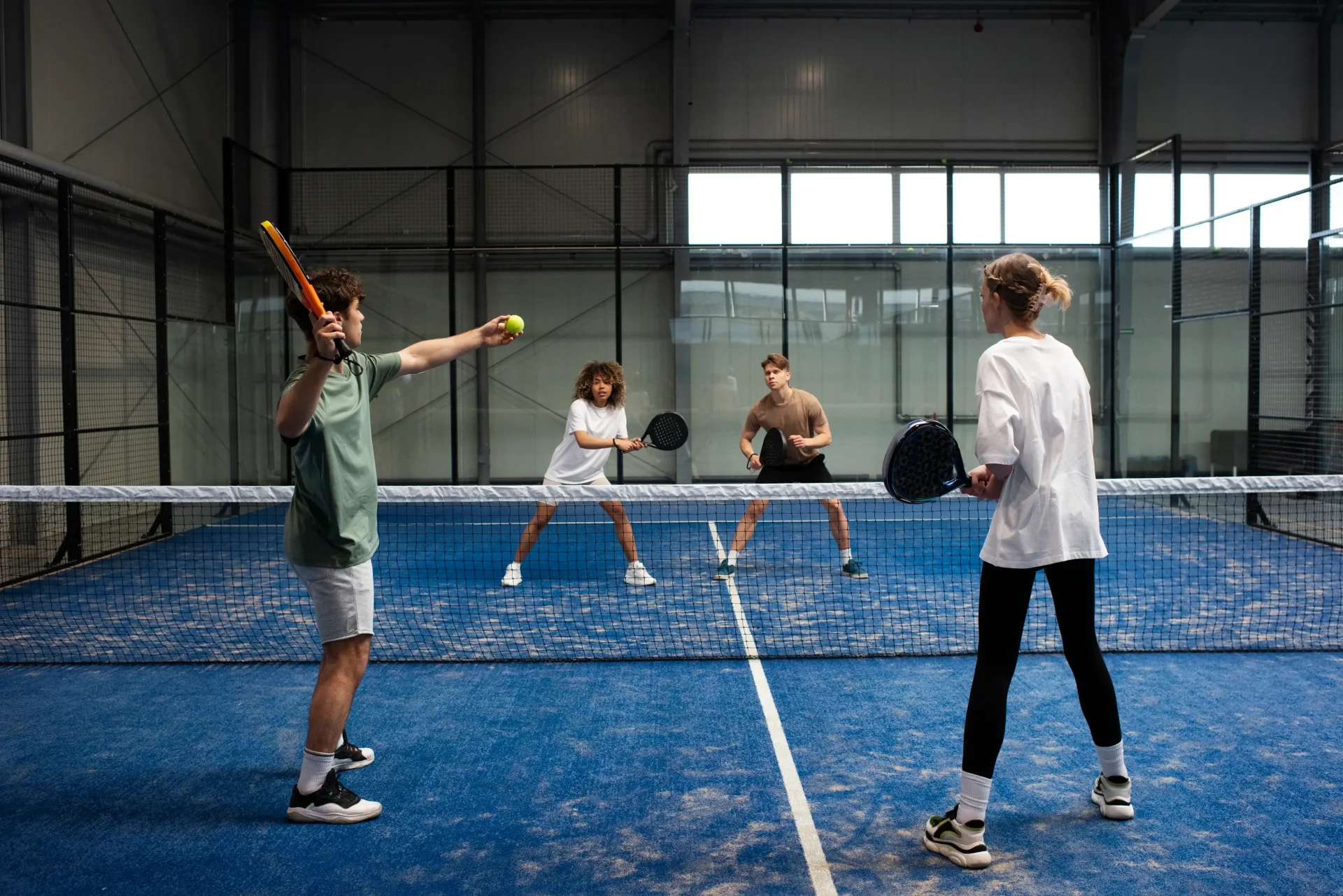 people-playing-padle-tennis-inside people-playing-padle-tennis-inside